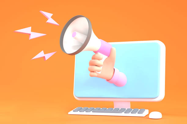 istock Hand holding megaphone coming out from computer. Digital marketing 1372938739