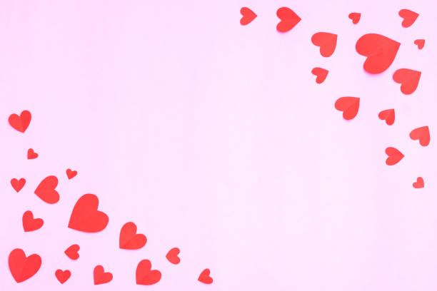istock Hearts papercut on pink background 1372940503