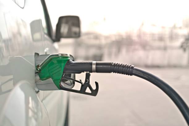 refilling an car with fuel at the gas station. horizontal image with copy space. - ethanol fotos stockfoto's en -beelden
