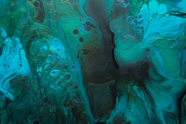 istock Fluid Art. Green, Black and blue abstract waves with golden particles. Marble effect background or texture 1372940991