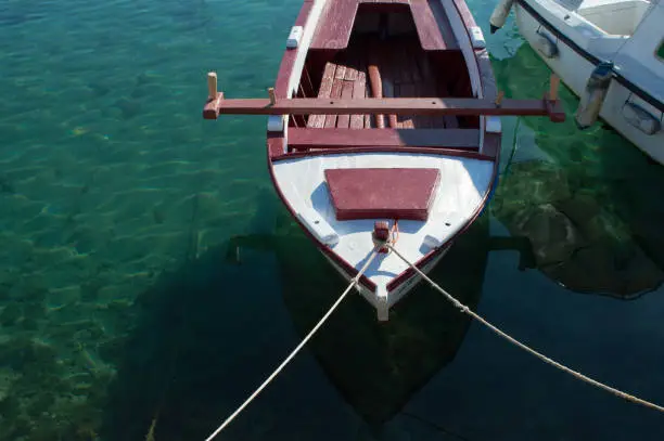 Traditional small wooden fishing boat moored in marina, in Bibinje, Croatia