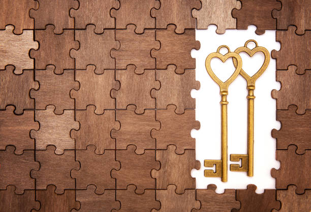istock Heart shaped keys on a jigsaw puzzle background 1372942908