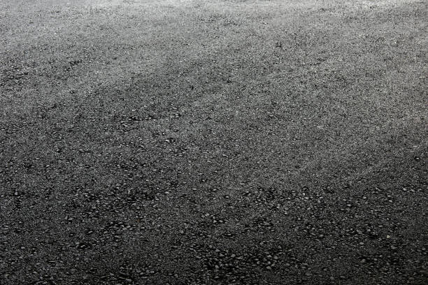 istock asphalt surface on a big city road 1372944747