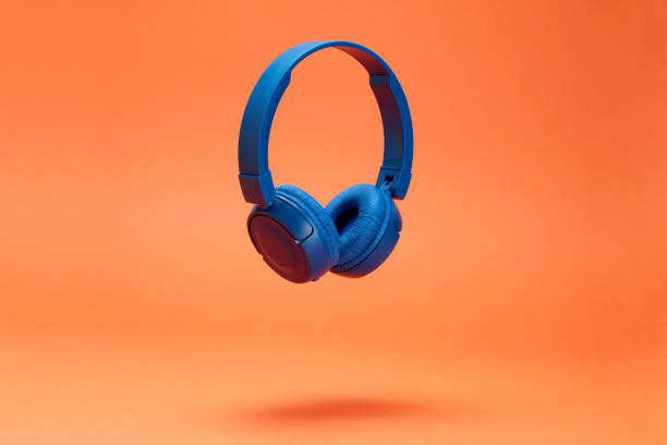 istock Headphones on the orange color background 1372944844