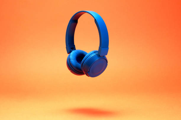 istock Headphones on the orange color background 1372944859