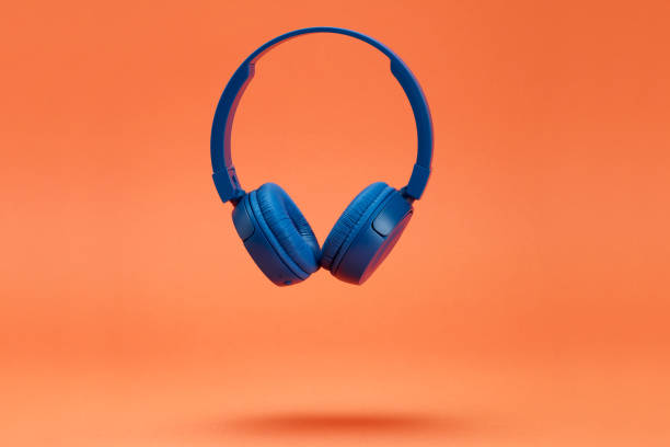 istock Headphones on the orange color background 1372944867