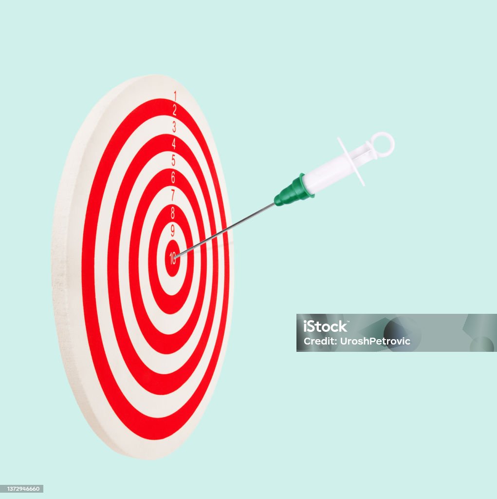 Target with vaccine syringe hit in center. Bullseye medical prevention goal concept. Success with vaccination immunization idea This is a classic target with vaccine syringe in bullseye. Abstract Stock Photo