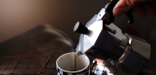 istock Coffee beans in Moka pot and smoke. 1372946961