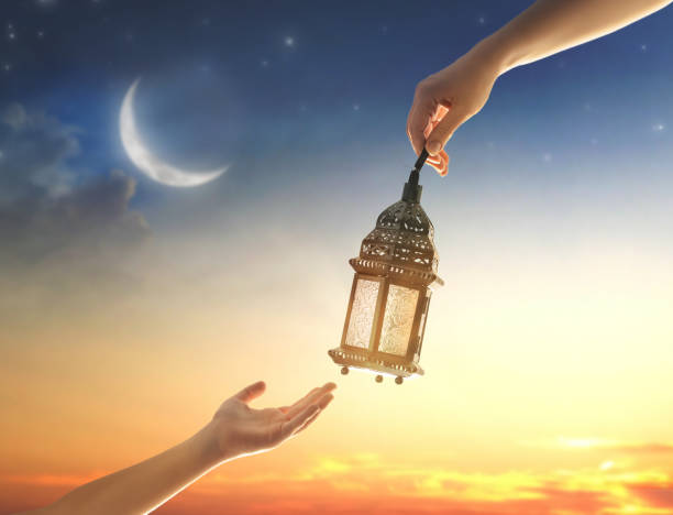 istock Ornamental Arabic lantern with burning candle 1372948490
