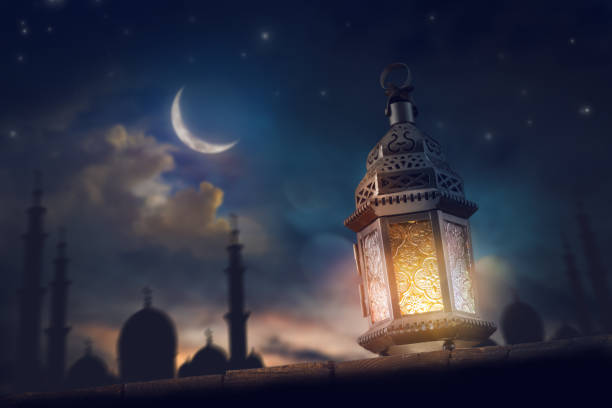 istock Ornamental Arabic lantern with burning candle 1372948491