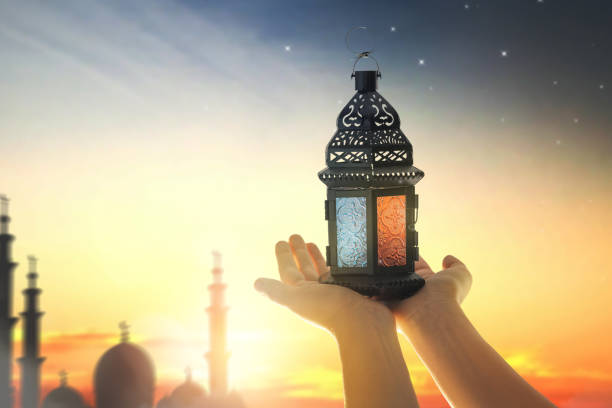 istock Ornamental Arabic lantern with burning candle 1372948494