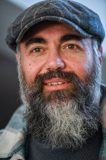 istock Portrait of man with cap and beard 1372951688
