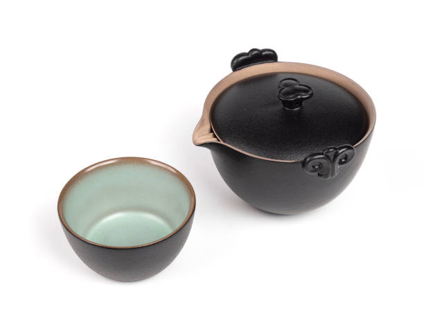 istock Chinese Black Porcelain Tea cup and Teapot on White Background 1372952805
