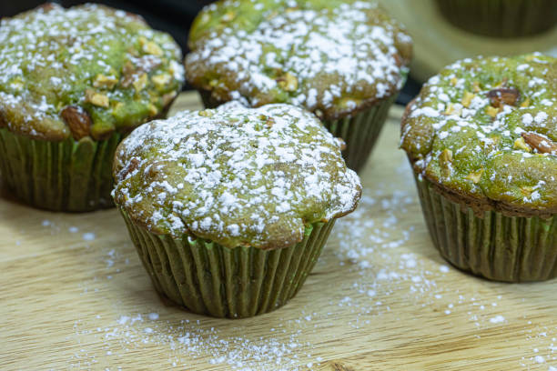 Green tea muffins isolated on wooden background. stock photo