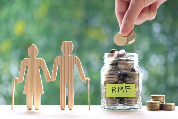 RMF - Retirement Mutual Fund, Love couple senior with coins money in glass bottle on natural green background, Save money for prepare in future and pension retirement concept