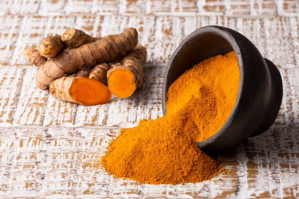 istock Fresh Organic Root And Turmeric Powder - Curcuma Longa 1372957889