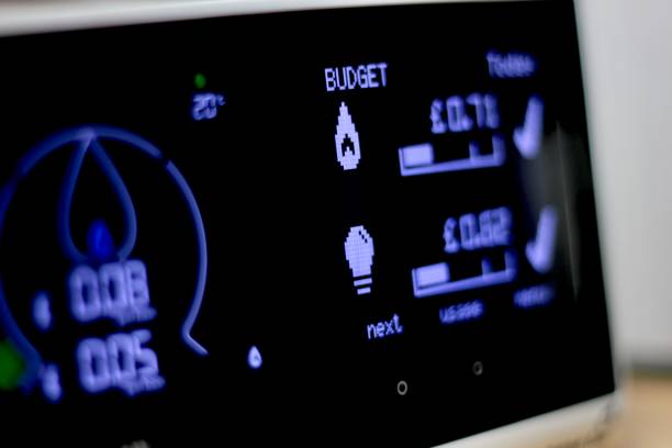 Household Budget Close up of a domestic smart meter for gas and electricity. cost of living stock pictures, royalty-free photos & images