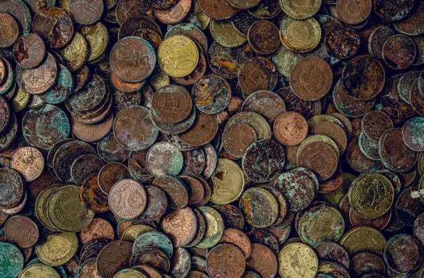 Corroding coins - money depreciation - inflation, reduced value
