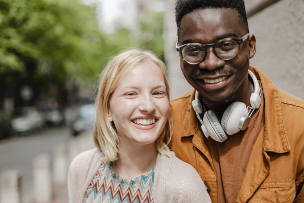 istock Happy young people on the street 1372962510