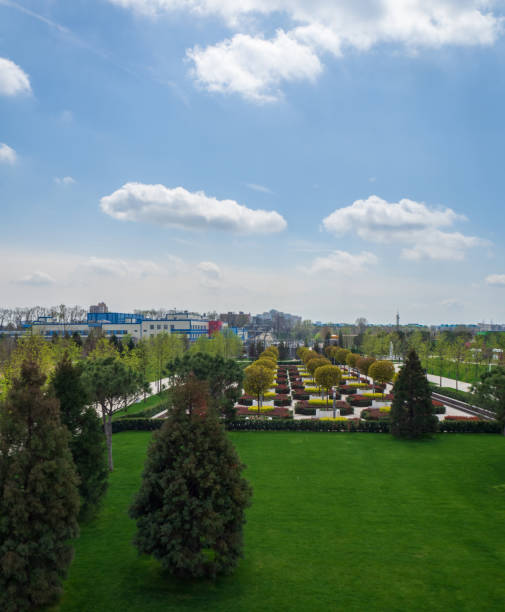istock An elegant city park under a blue sky with white clouds. 1372962552