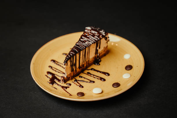 Close-up Slice of Chocolate Cake With Black Background stock photo