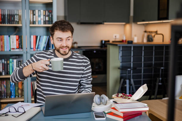 istock Working on laptop and drinking morning coffee 1372968015