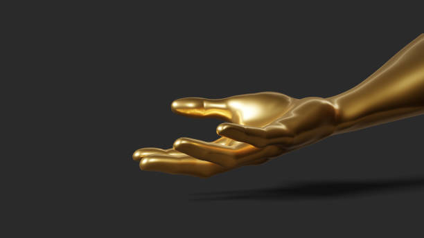 istock Hand gesture. Hand in gold paint, shiny, metallic. Isolated on black background. 1372971575