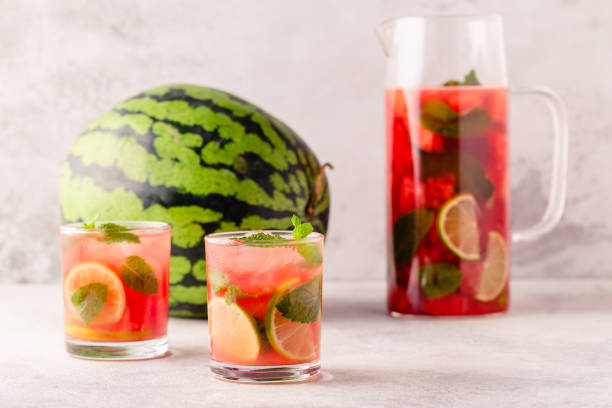 istock Fresh tasty delicious watermelon lemonade on a light background 1372974388