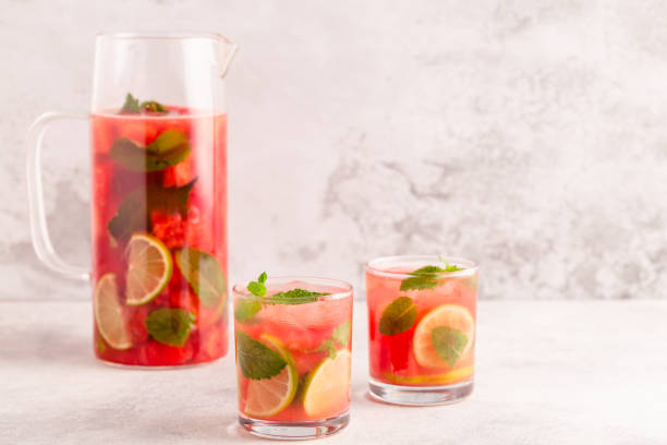 istock Fresh tasty delicious watermelon lemonade on a light background 1372974458