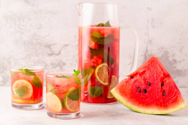 istock Fresh tasty delicious watermelon lemonade on a light background 1372974476