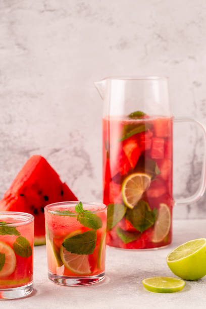 istock Fresh tasty delicious watermelon lemonade on a light background 1372974594