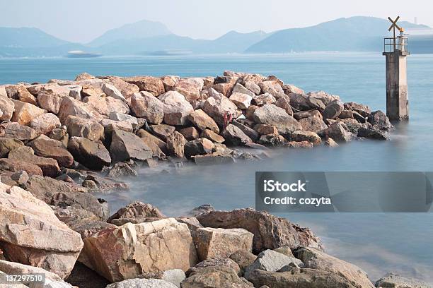 Lighthouse On A Rocky Breakwall Stock Photo - Download Image Now - Beach, Charlevoix, Coastline