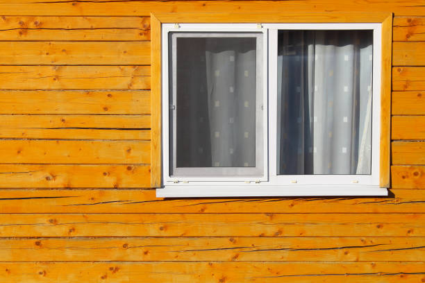 istock Double-glazed windows in a wooden house. Close-up. Background. Texture. 1372976867