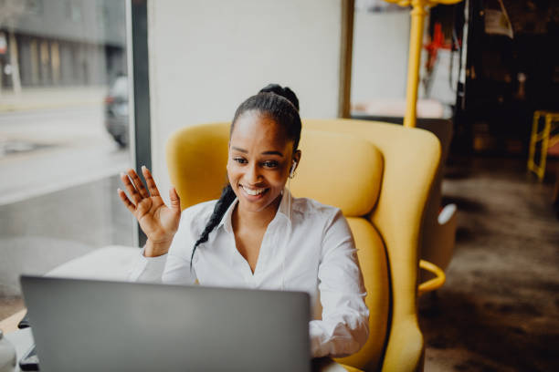 istock Smiling  young female waving during an online conversation 1372977878