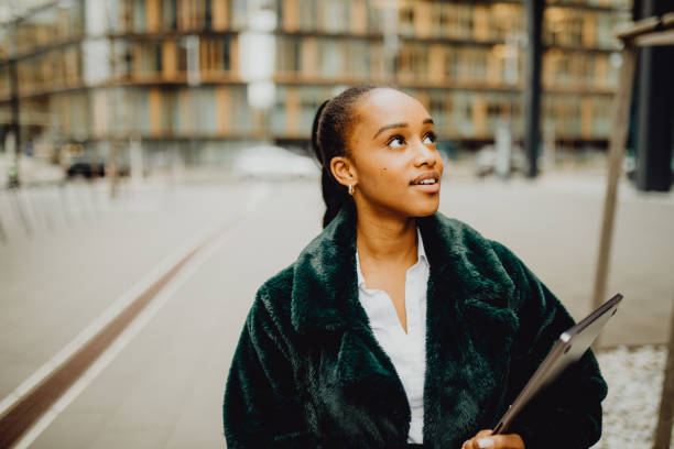 istock Beautiful female outside with her laptop 1372977962