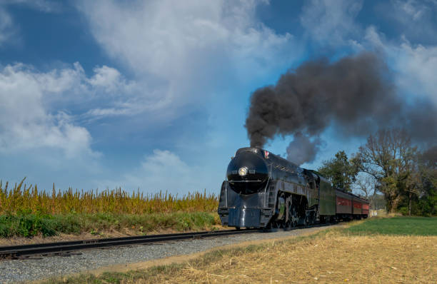 istock Antique Restored Steam Engine Approaching on Some Old Rail Road Tracks 1372979130