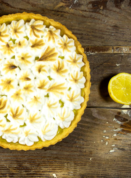istock homemade lemon meringue pie with lemon fruit on wooden background 1372979426