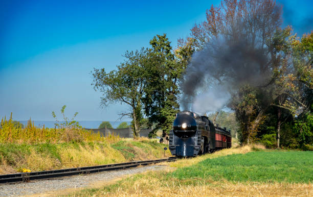 istock Antique Restored Steam Engine Approaching on Some Old Rail Road Tracks 1372980417