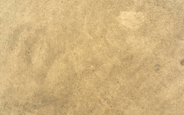 istock close up retro plain tan color cement wall   background texture for show or advertise or promote product and content on display and web design element concept 1372983088
