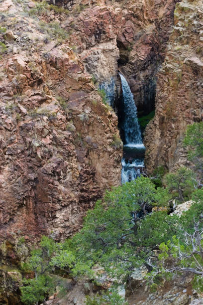 istock A Waterfalls in Between the Rock Mountains 1372985212