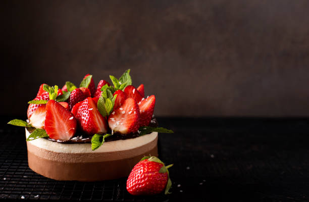 istock chocolate coffee cake with fresh strawberries and mint 1372985234