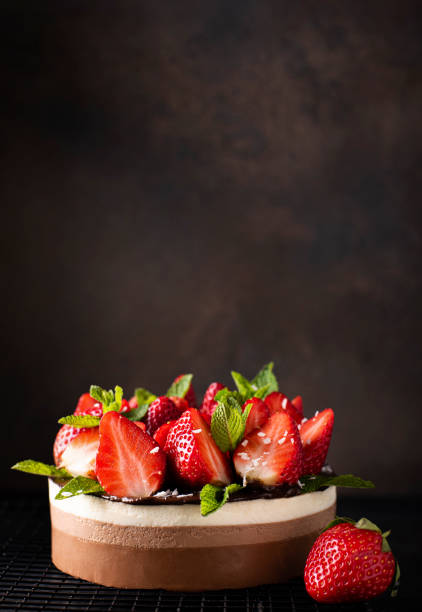 istock chocolate coffee cake with fresh strawberries and mint 1372985476