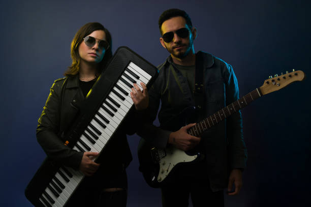 istock Artistic musicians with hipster outfits 1372990800