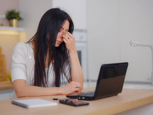 istock Stressed overworked business woman working from home , 1372990971