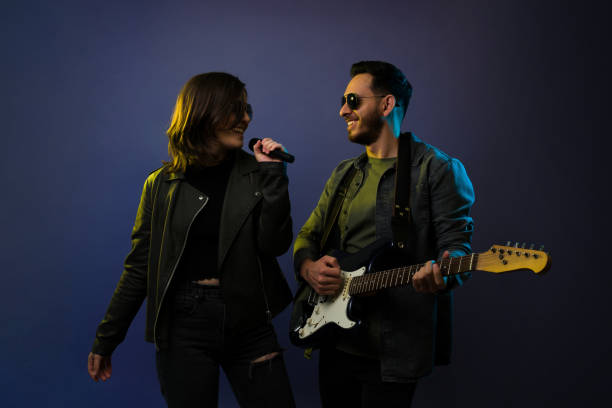 istock Happy rock band rehearsing 1372991063