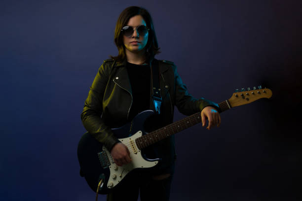 istock Female rock star rehearsing 1372991304