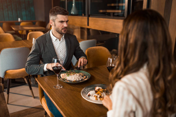 istock Arguing couple eating lunch in a restaurant. 1372999991
