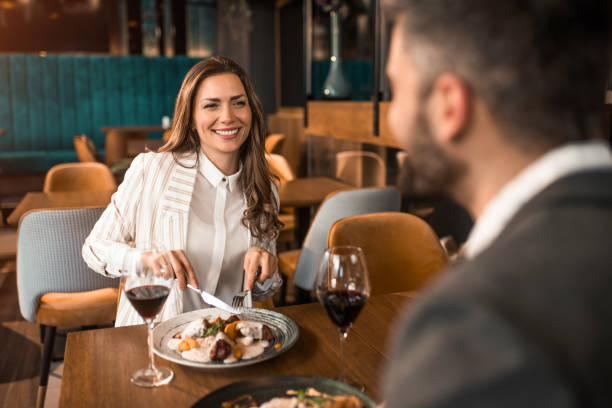 istock Cheerful couple eating lunch in a restaurant. 1373000149