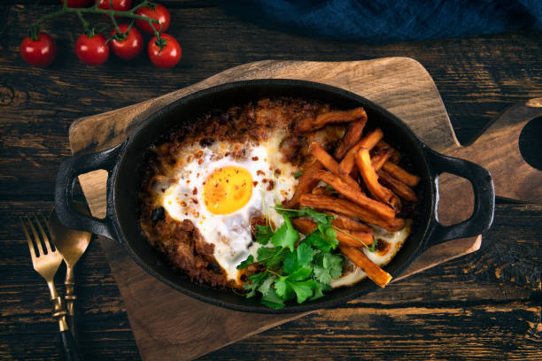 istock Casserole with beef, onions, cheese and eggs close-up in a pan 1373002932
