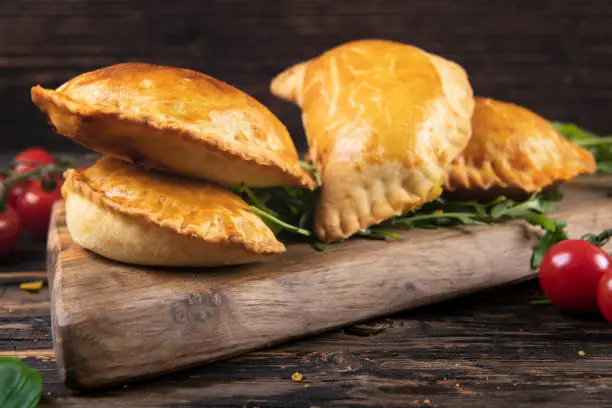 Cornish Pasty on wooden dark table